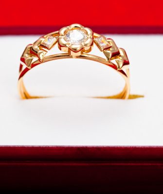 Fantastic gold ring adorned with several white zirconia